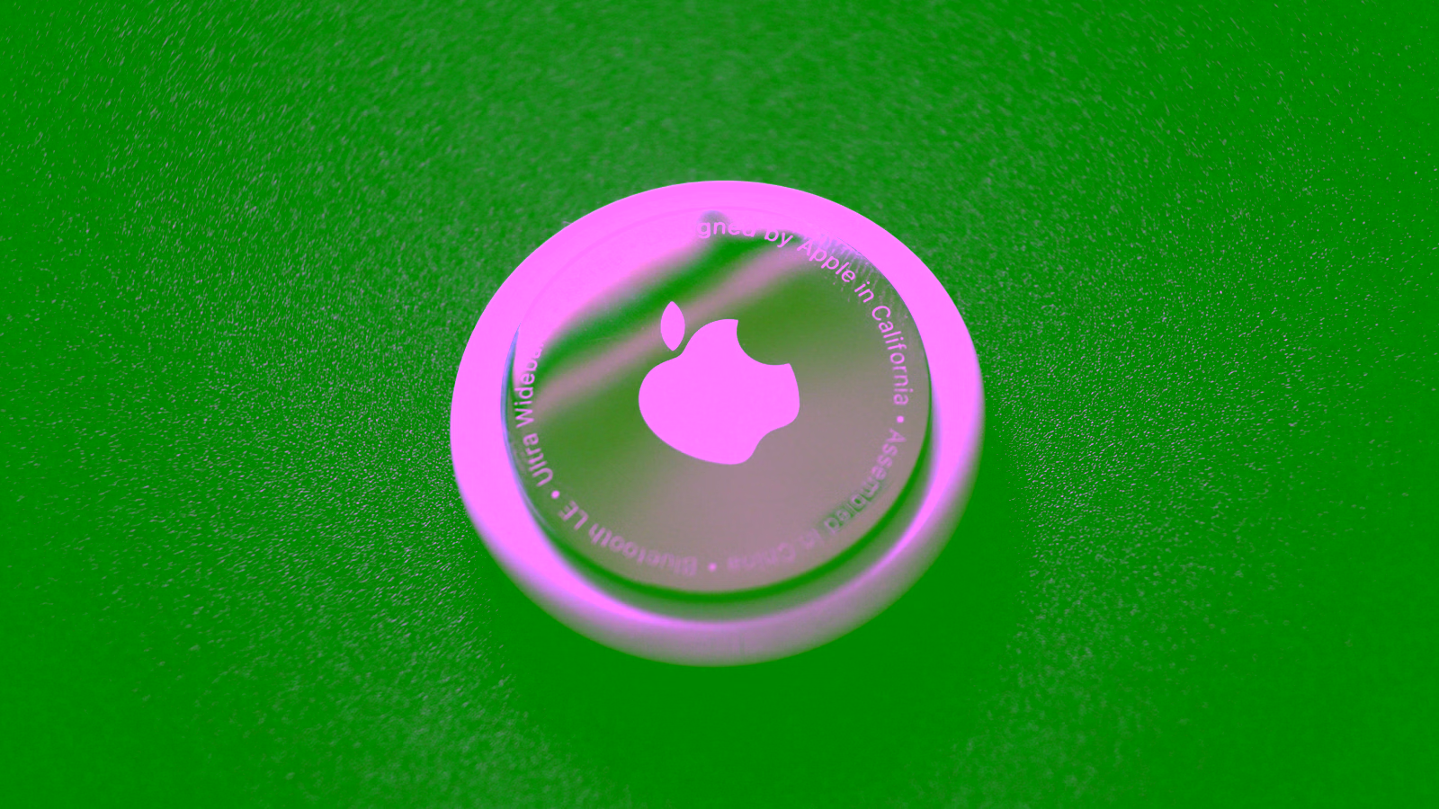 Apple AirTag on dark surface