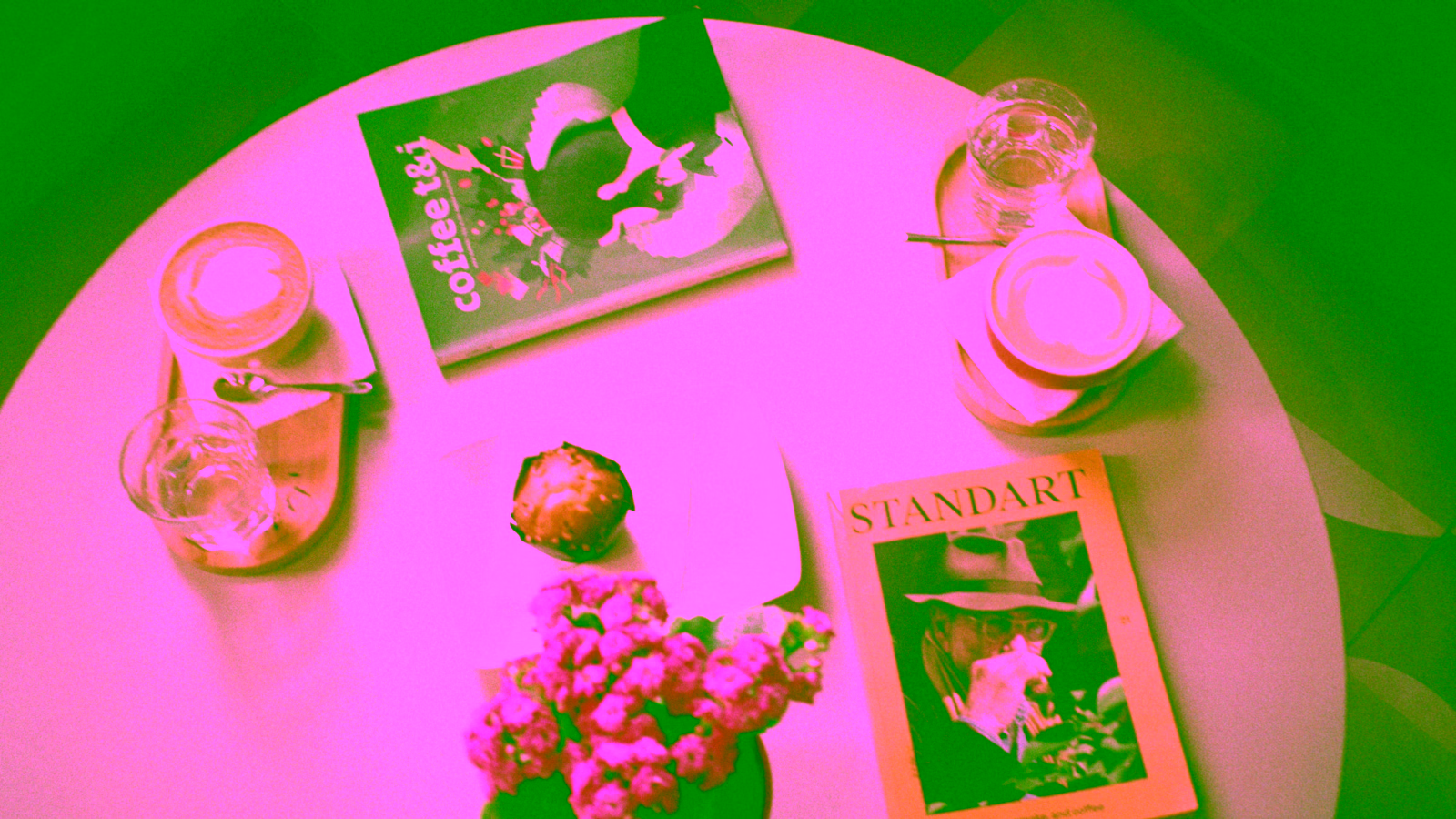 Cappuccinos and pastry at coffee shop table