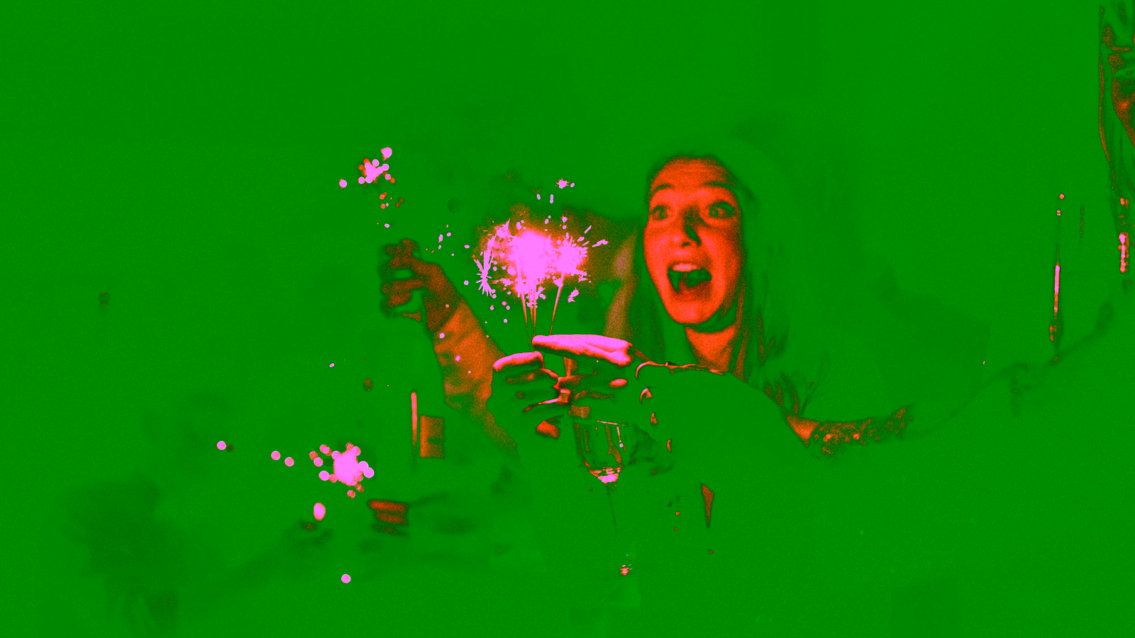 People celebrating New Year's with sparklers and champagne