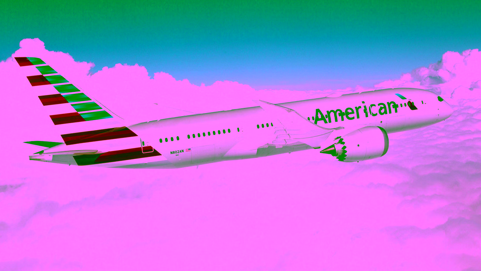 american airlines plane flying in the cloudes