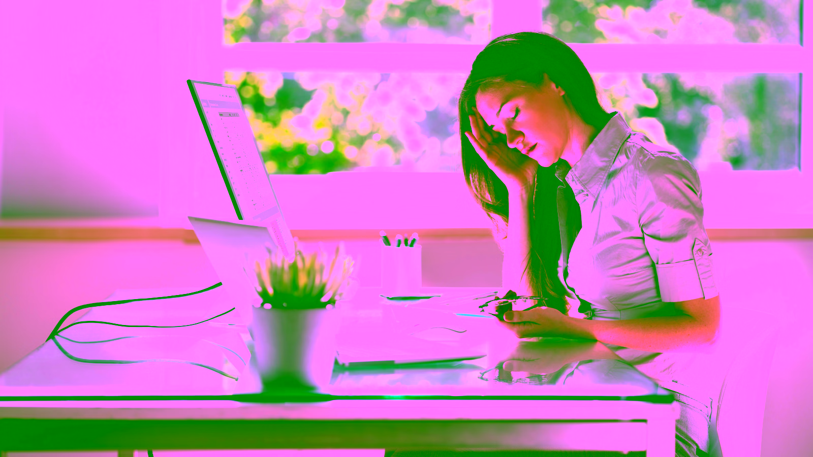 Stressed woman working at a desk