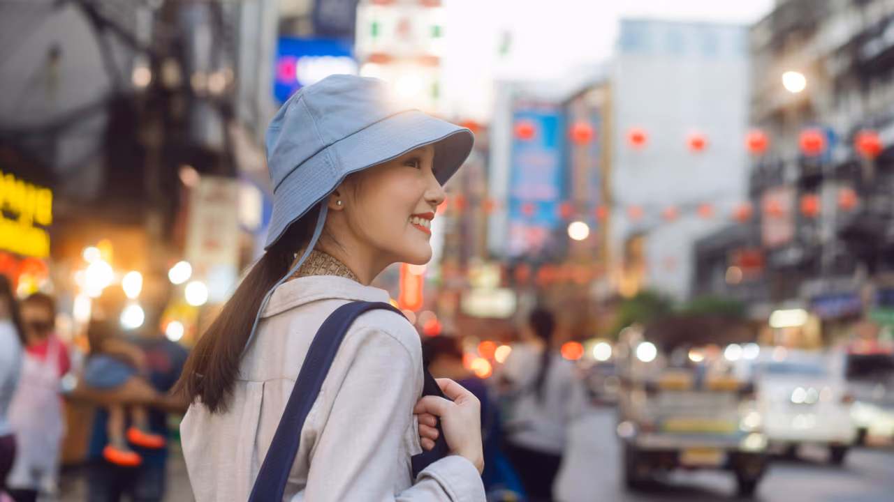 Smiling woman in a busy city street